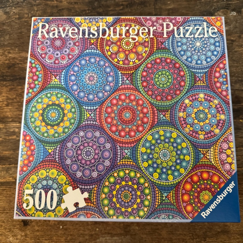 Two Ravensburger Mandala Puzzle with Red, Blue, and Purple